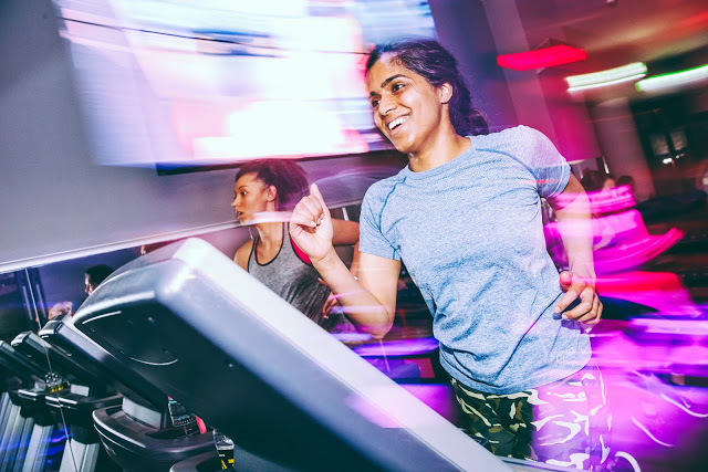 indian woman running on treadmill